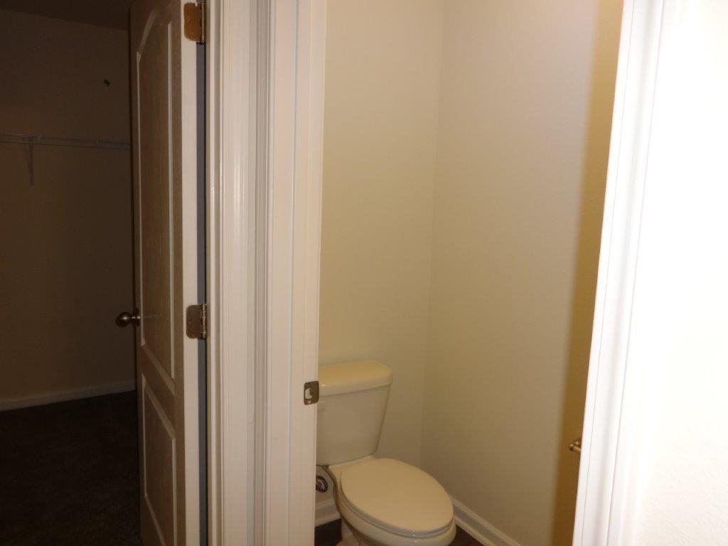 382 Falcon Ridge Road St. Augustine, FL 32084 - Photo 9 of 21 a white toilet sitting next to a shower
