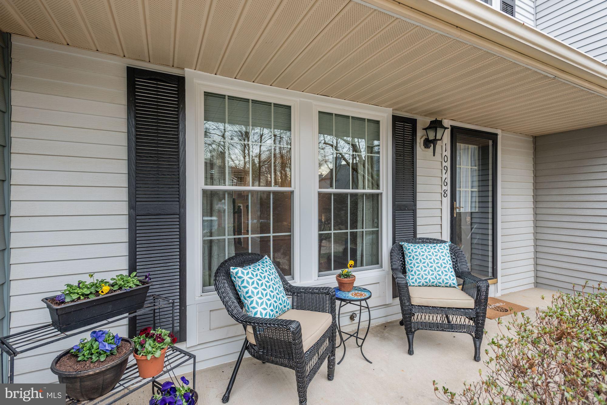 10968 Granby Court Reston, VA 20191 - Photo 2 of 33 a outdoor living space with furniture and a potted plant