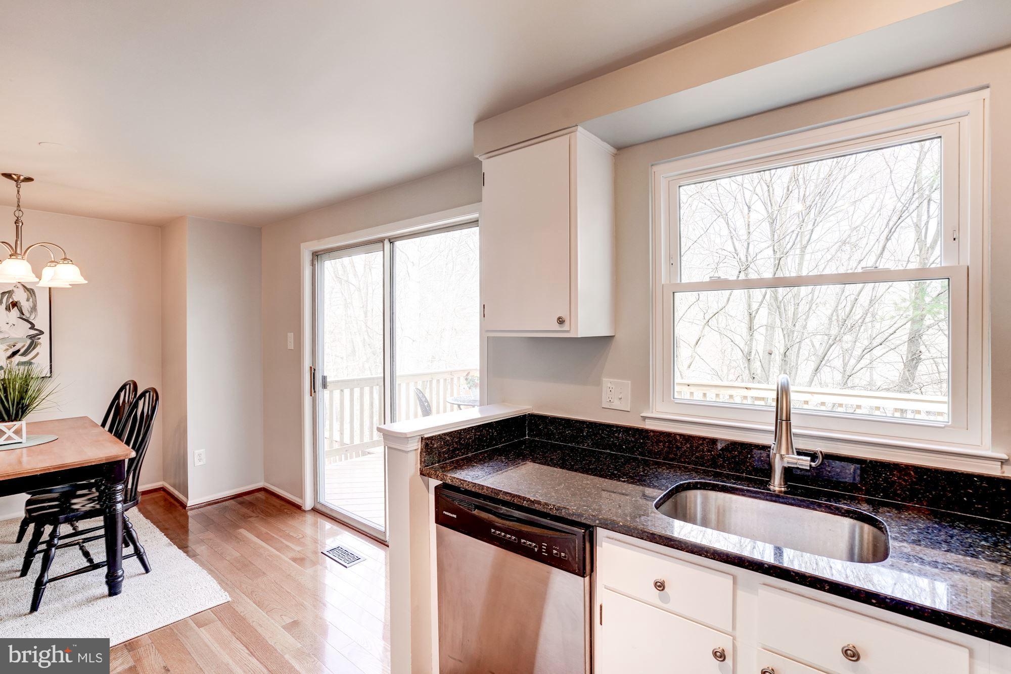 10968 Granby Court Reston, VA 20191 - Photo 11 of 33 a kitchen with granite countertop a sink and a window