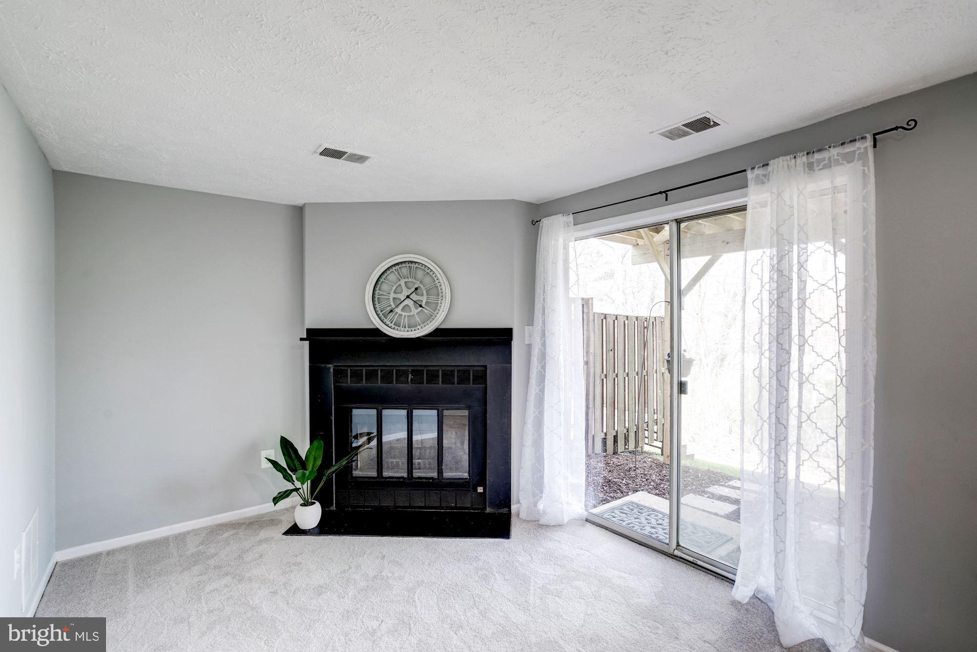 10968 Granby Court Reston, VA 20191 - Photo 26 of 33 a living room with furniture and a window