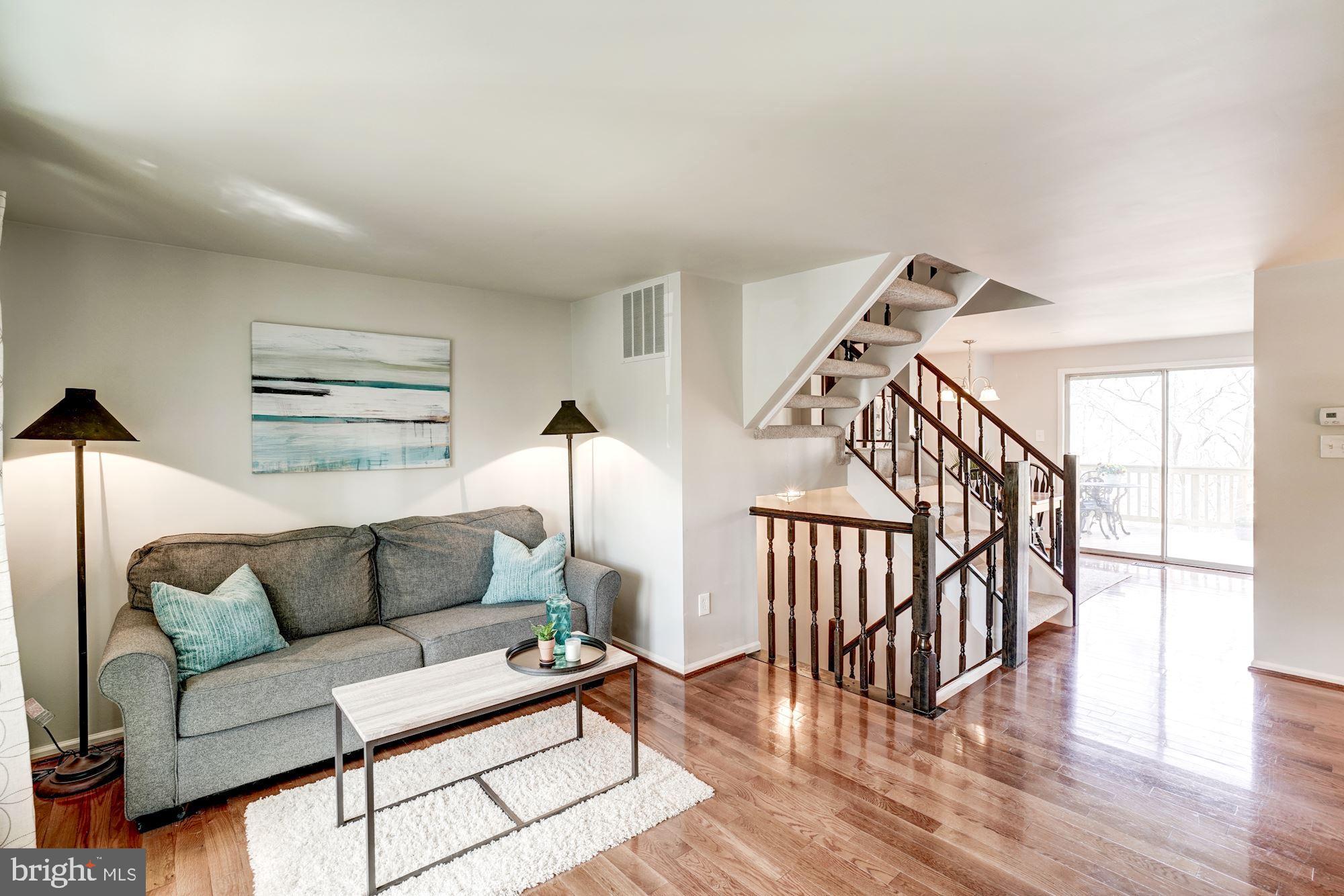 10968 Granby Court Reston, VA 20191 - Photo 32 of 33 a living room with furniture and wooden floor