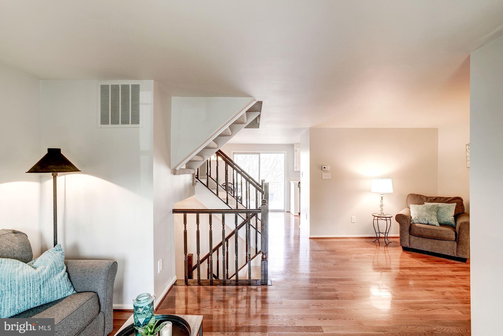 10968 Granby Court Reston, VA 20191 - Photo 33 of 33 a living room with furniture and wooden floor