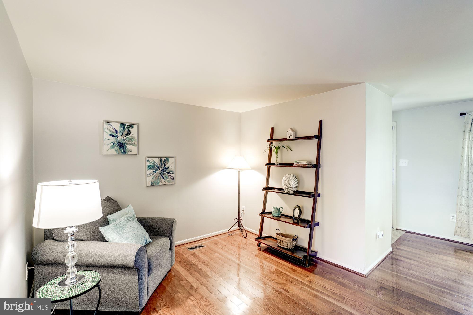 10968 Granby Court Reston, VA 20191 - Photo 5 of 33 a living room with furniture and wooden floor