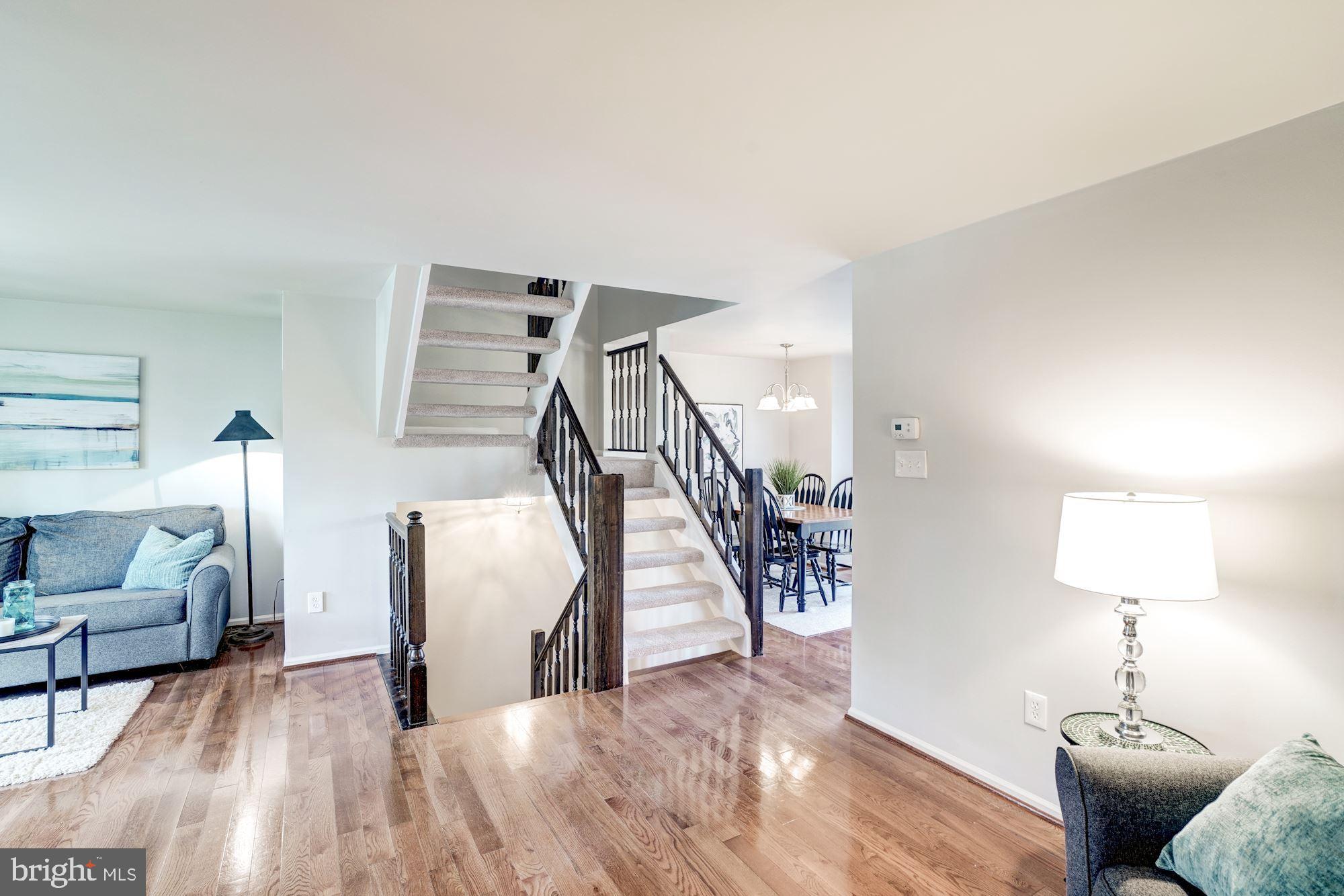 10968 Granby Court Reston, VA 20191 - Photo 6 of 33 a living room with furniture and a wooden floor