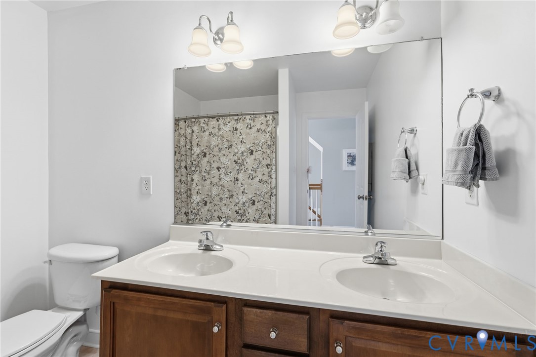 5418 Trail Ride Court Moseley, VA 23120 - Photo 37 of 52 2nd Hall Bath with tub/shower and dual vanity
