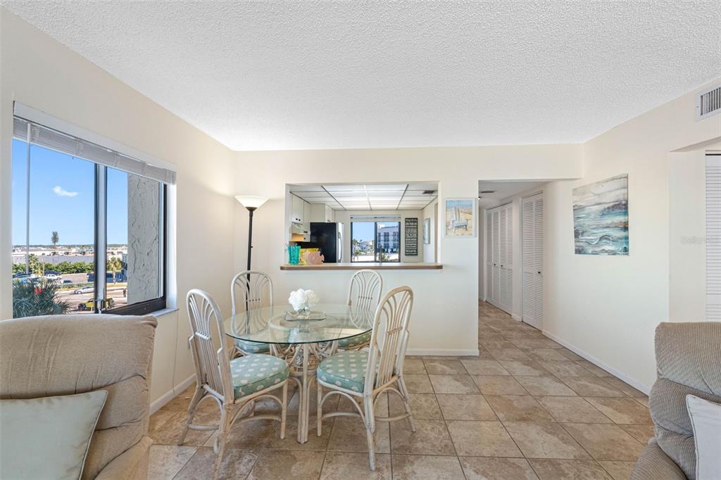 15000 Gulf Boulevard, Unit 408 Madeira Beach, FL 33708 - Photo 12 of 35 a dining room with furniture and window