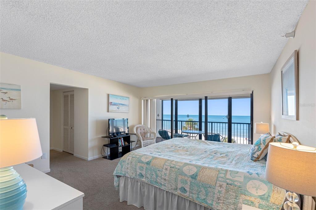 15000 Gulf Boulevard, Unit 408 Madeira Beach, FL 33708 - Photo 13 of 35 a bed sitting in a spacious bedroom next to a window
