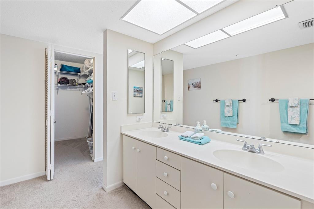 15000 Gulf Boulevard, Unit 408 Madeira Beach, FL 33708 - Photo 24 of 35 a bathroom with a sink double vanity and a mirror