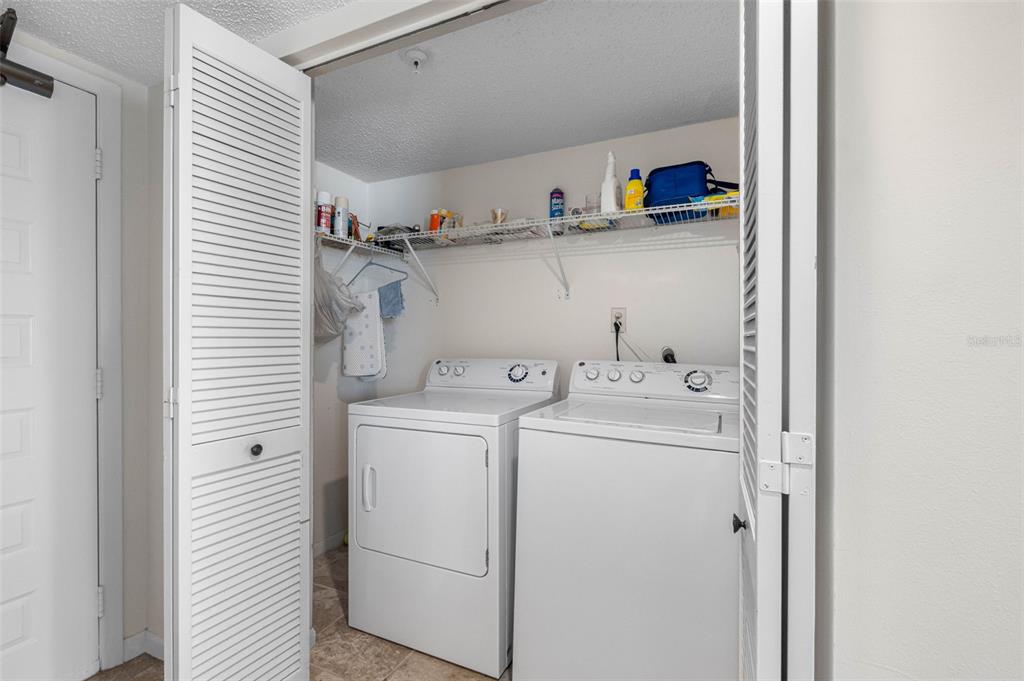 15000 Gulf Boulevard, Unit 408 Madeira Beach, FL 33708 - Photo 33 of 35 a view of storage and utility room with washer and dryer