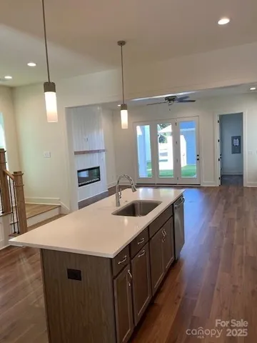 a kitchen with a sink and center island