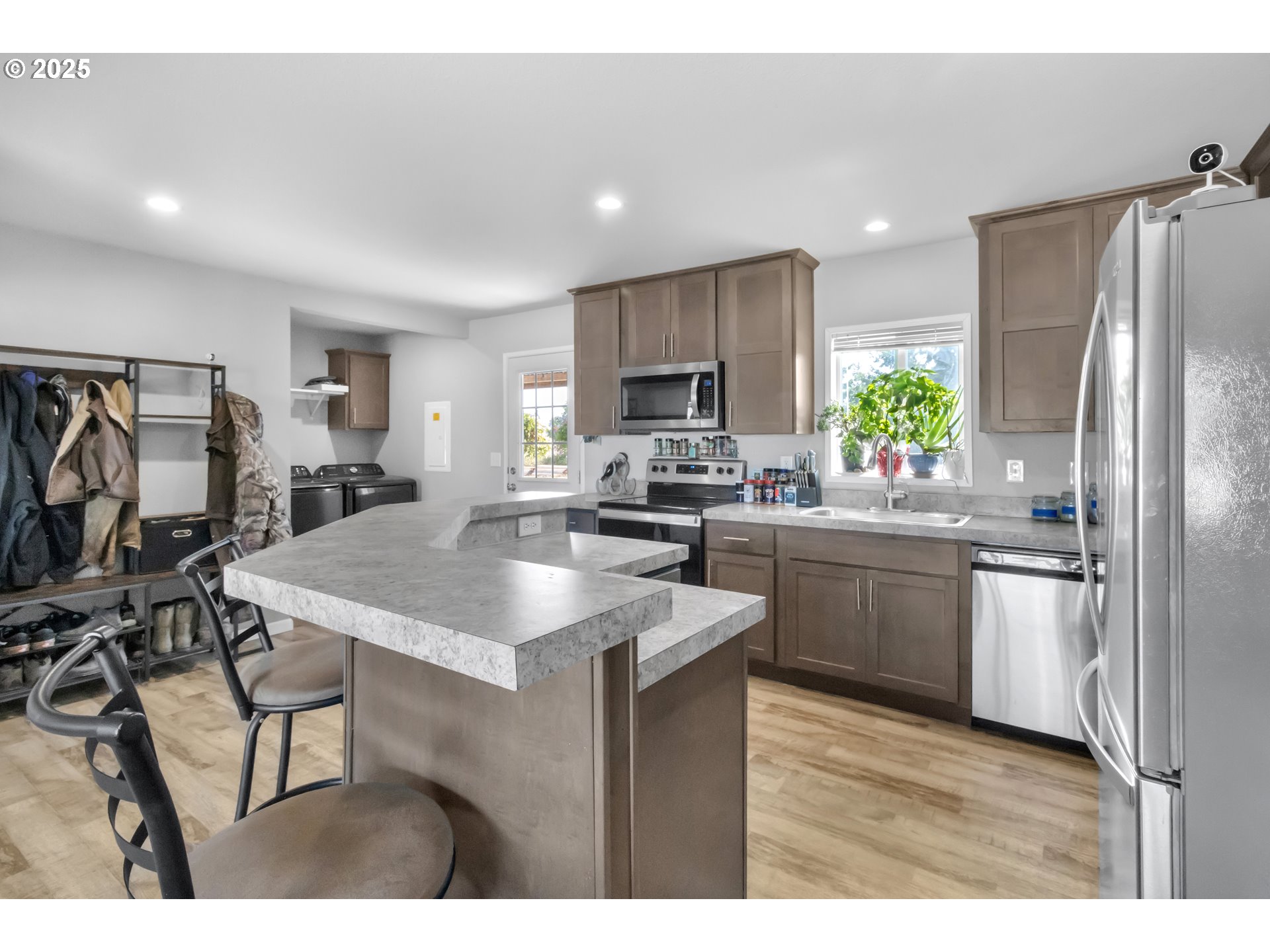 24550 Southwest Red Prairie Road Sheridan, OR 97378 - Photo 13 of 33 a kitchen with kitchen island a sink stove and refrigerator
