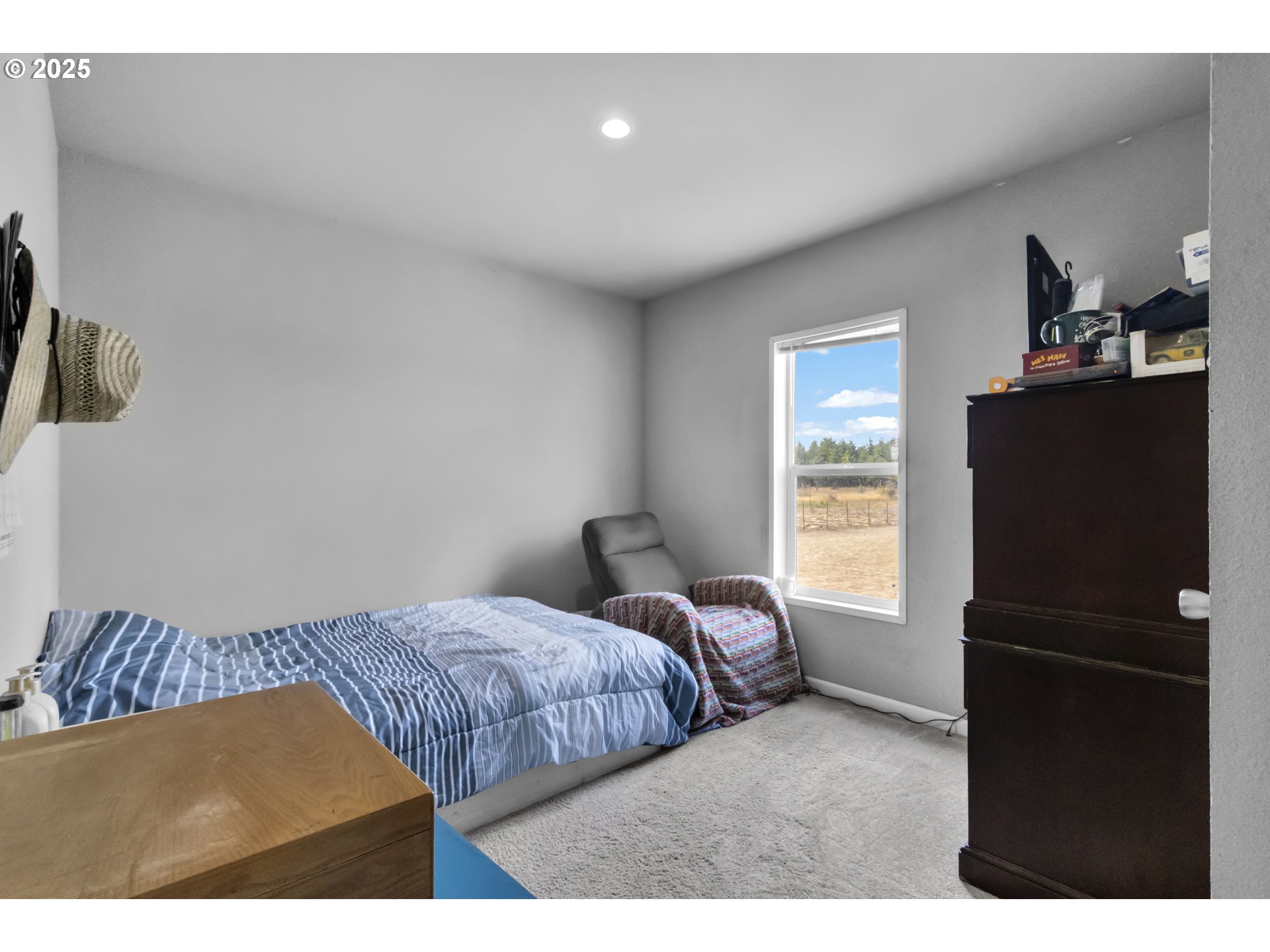 24550 Southwest Red Prairie Road Sheridan, OR 97378 - Photo 19 of 33 a bedroom with a bed and a window