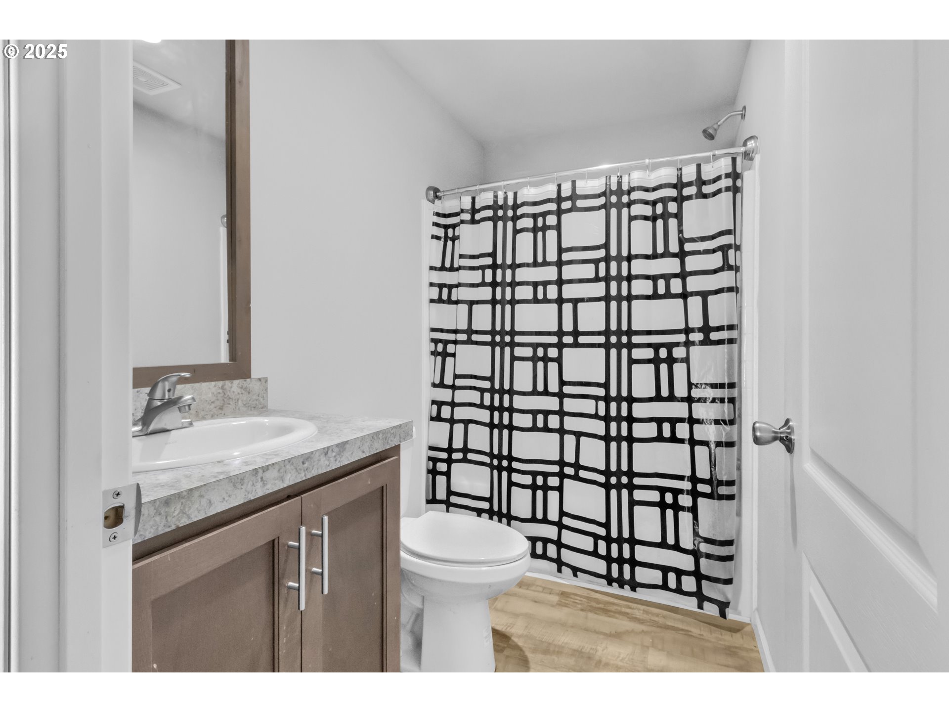 24550 Southwest Red Prairie Road Sheridan, OR 97378 - Photo 20 of 33 a bathroom with a granite countertop sink toilet and mirror