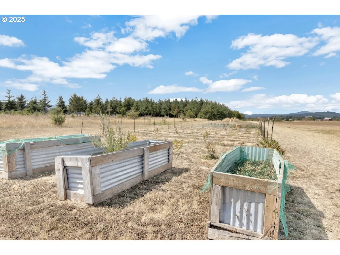 24550 Southwest Red Prairie Road Sheridan, OR 97378 - Photo 29 of 33 a backyard of a house with outdoor seating