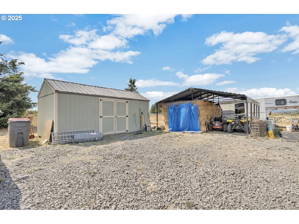 24550 Southwest Red Prairie Road Sheridan, OR 97378 - Photo 30 of 33 a front view of a house with a yard and garage