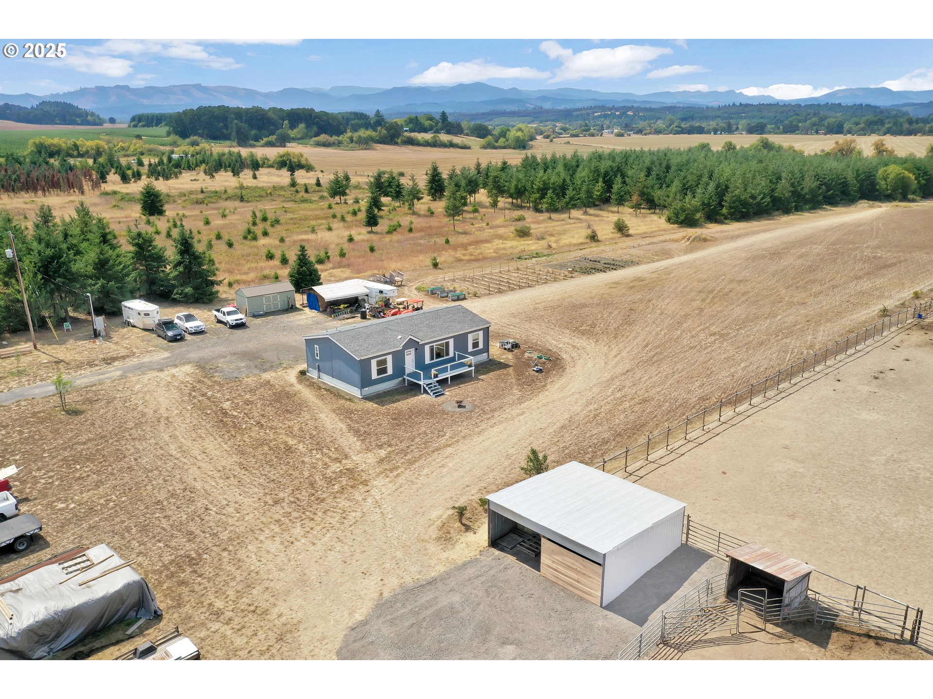 24550 Southwest Red Prairie Road Sheridan, OR 97378 - Photo 5 of 33 a view of a lake with a mountain