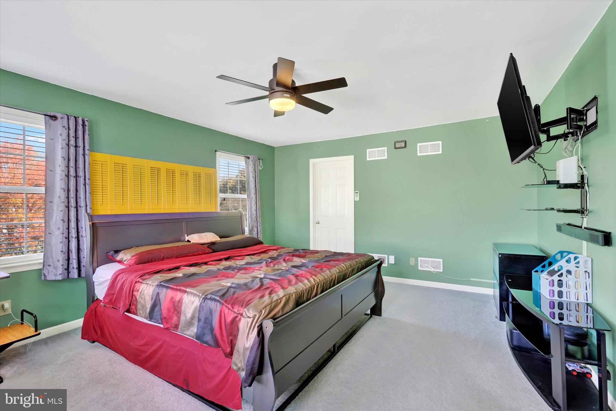 1109 Baltimore Road Shippensburg, PA 17257 - Photo 15 of 32 a bedroom with a bed and a flat screen tv