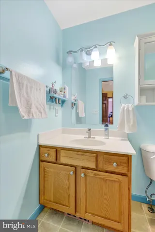 a room with a sink and a mirror