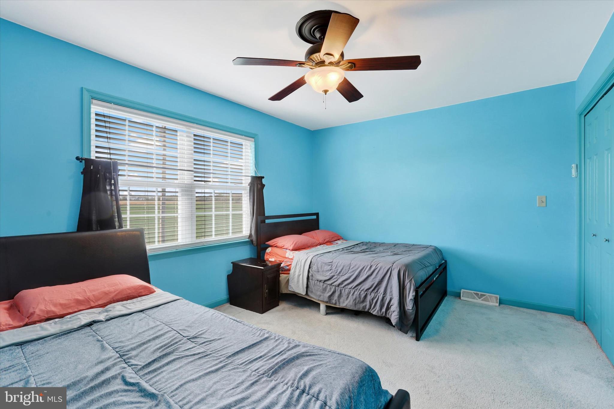 1109 Baltimore Road Shippensburg, PA 17257 - Photo 21 of 32 a bedroom with a bed and a large window