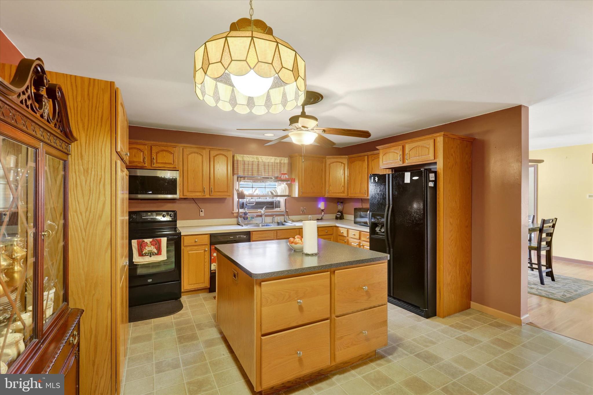 1109 Baltimore Road Shippensburg, PA 17257 - Photo 5 of 32 a kitchen with stainless steel appliances granite countertop a refrigerator and a sink