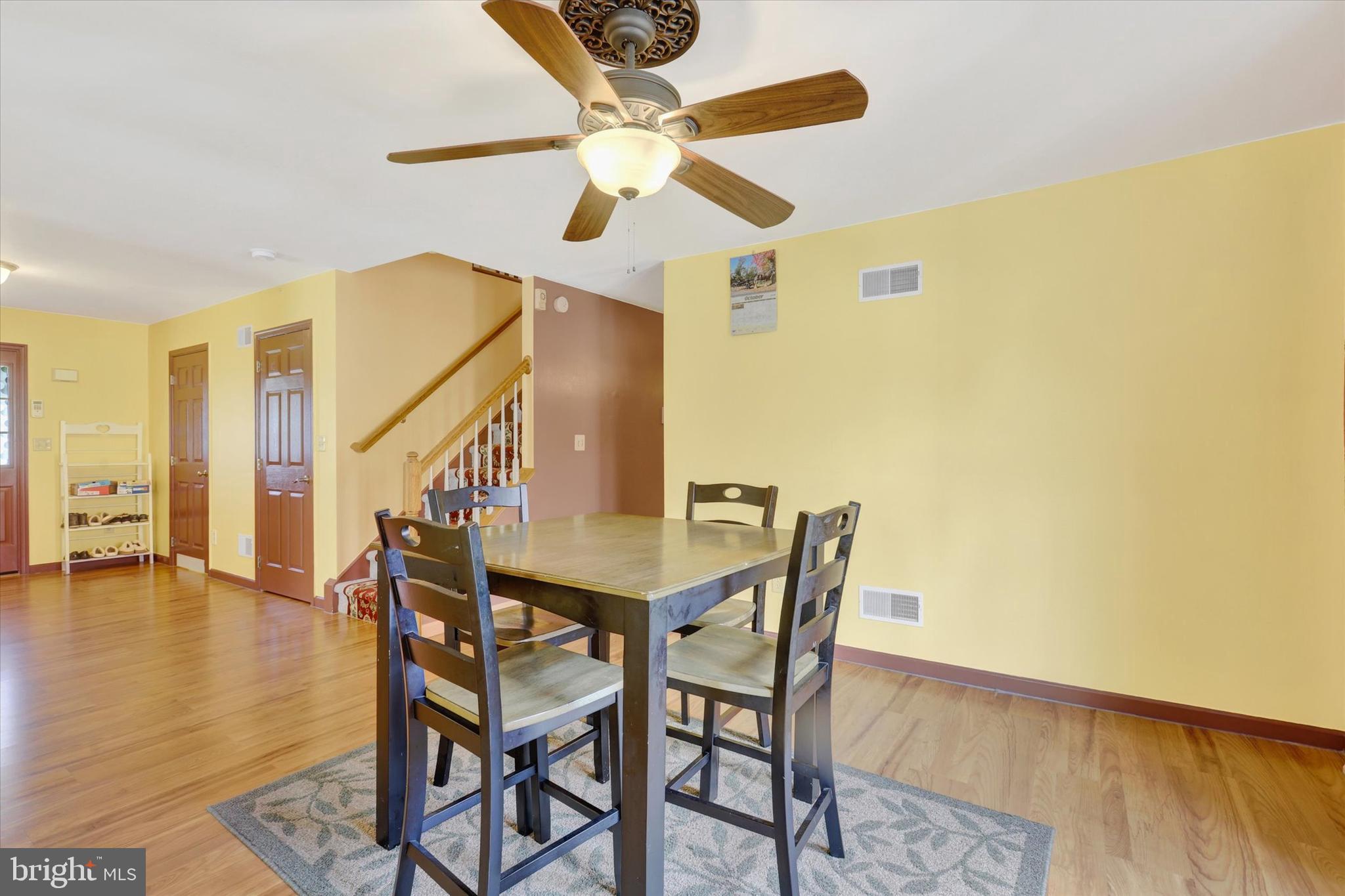 1109 Baltimore Road Shippensburg, PA 17257 - Photo 9 of 32 a view of a dining room with furniture and wooden floor