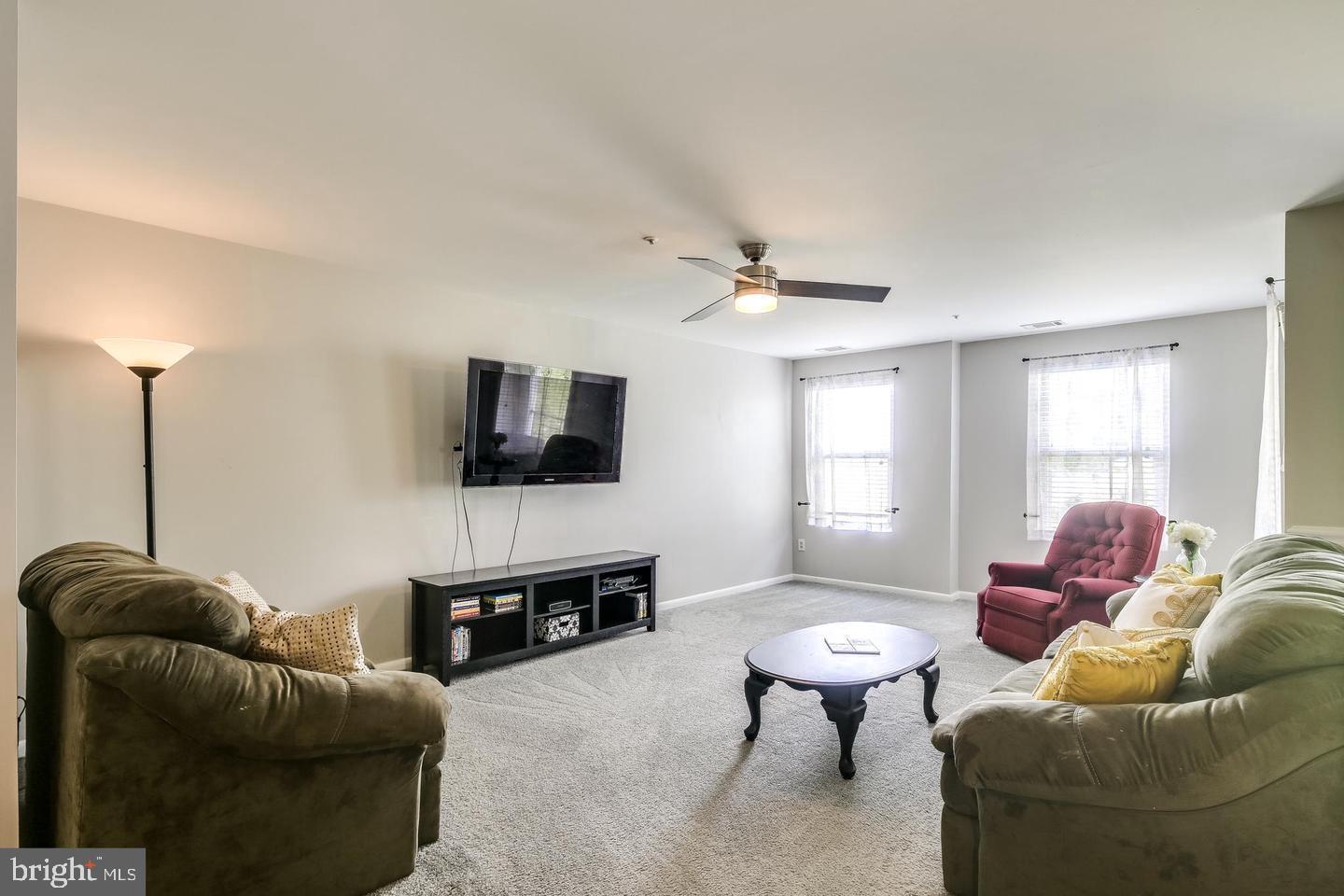 40 Greystone Court, Unit G Annapolis, MD 21403 - Photo 14 of 37 a living room with furniture and a flat screen tv