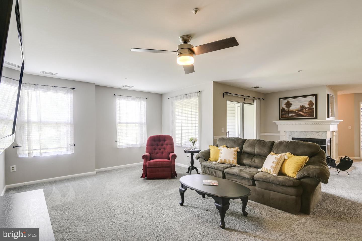 40 Greystone Court, Unit G Annapolis, MD 21403 - Photo 16 of 37 a living room with furniture and a window