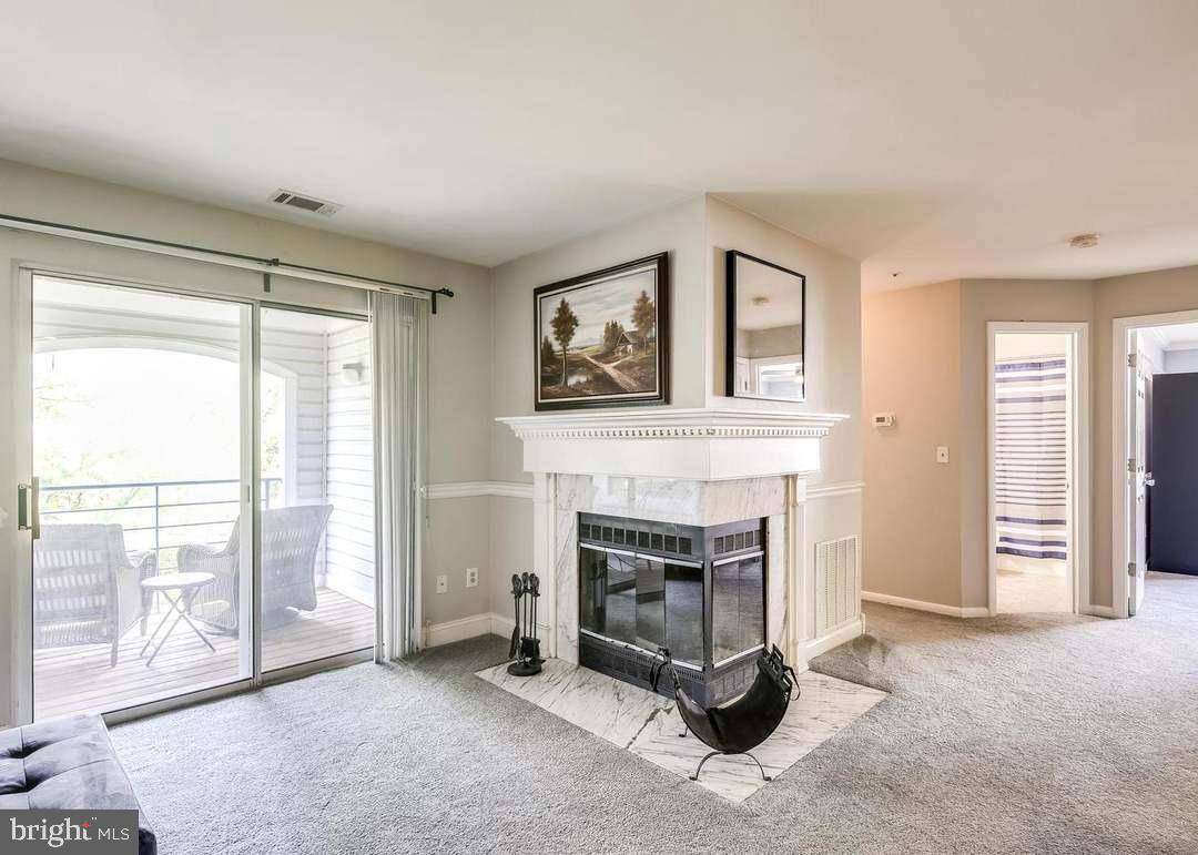 40 Greystone Court, Unit G Annapolis, MD 21403 - Photo 17 of 37 a living room with furniture and a fireplace