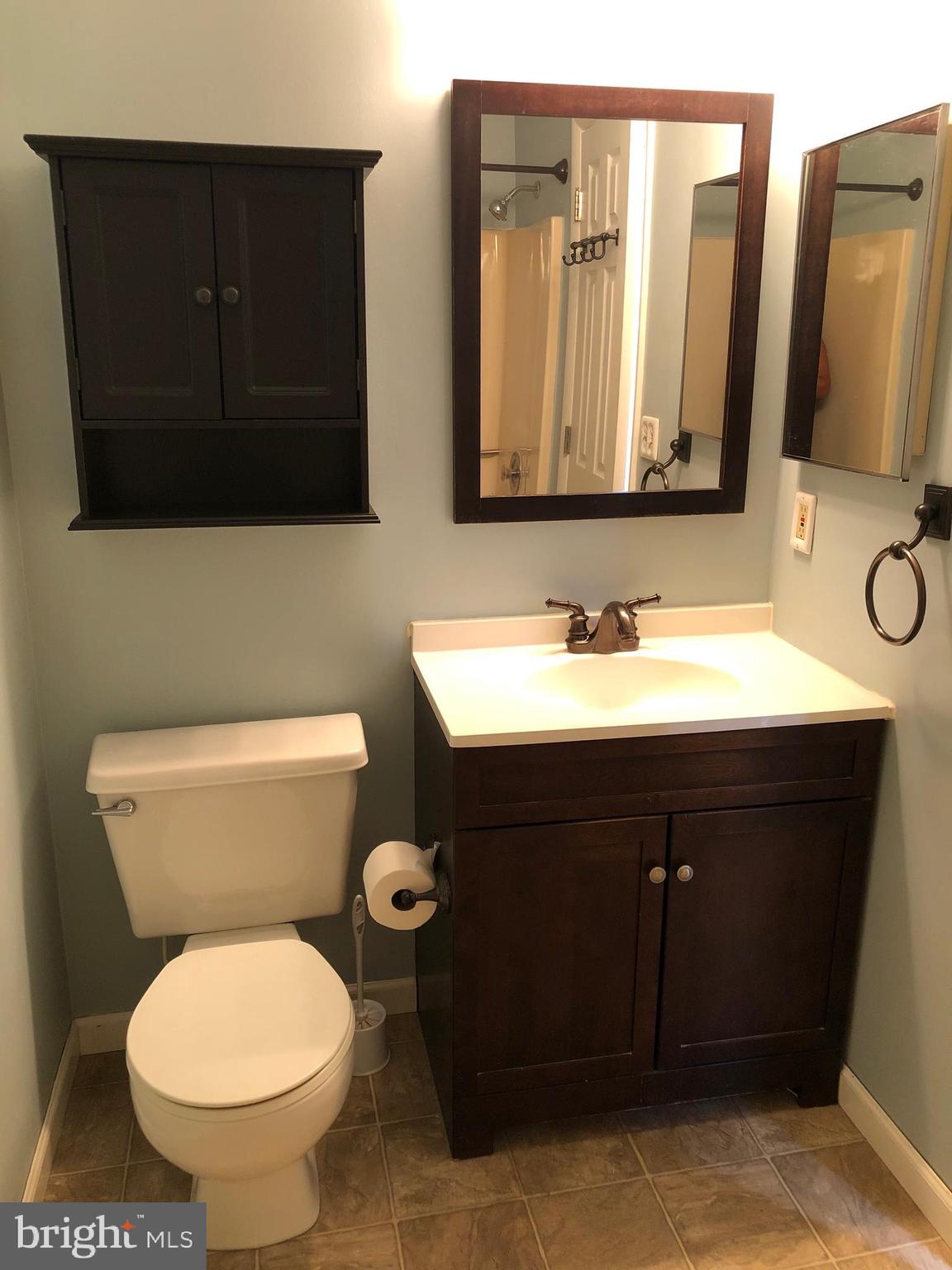 40 Greystone Court, Unit G Annapolis, MD 21403 - Photo 21 of 37 a bathroom with a toilet sink and mirror