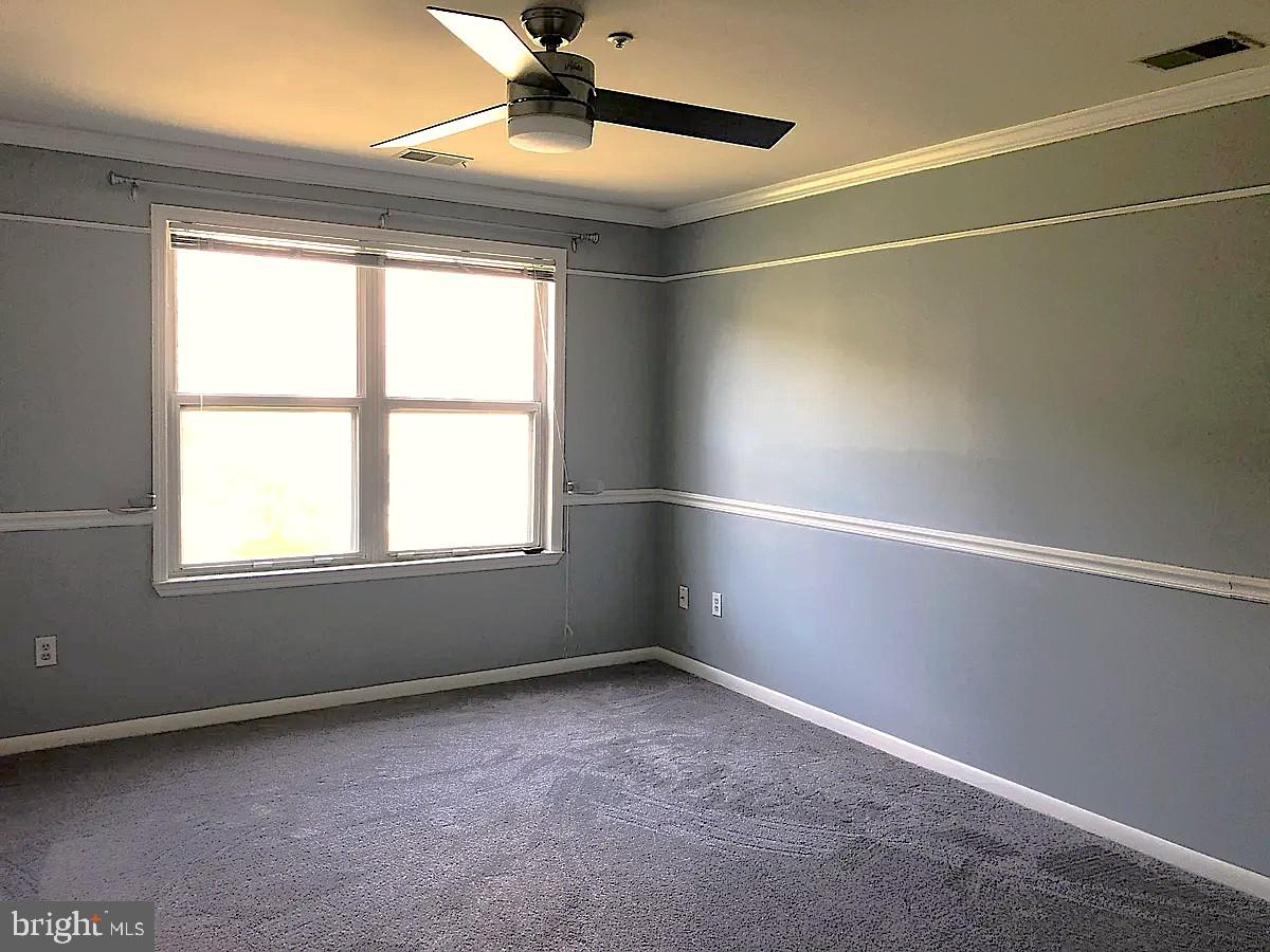 40 Greystone Court, Unit G Annapolis, MD 21403 - Photo 23 of 37 a view of an empty room with a window