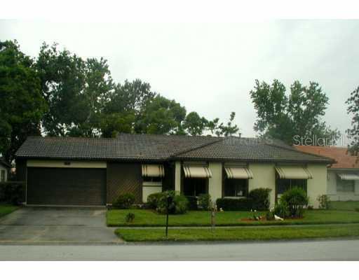 10109 Matchlock Drive Orlando, FL 32821 - Photo 1 of 1 a front view of a house with a garden