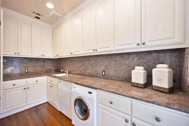 a bed room with a bed dresser and a large window