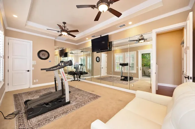 a living room with a flat screen tv and a table