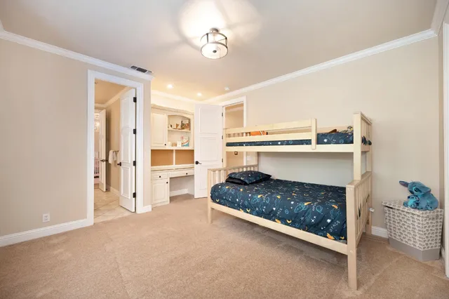 an aerial view of a house with a yard basket ball court and outdoor seating