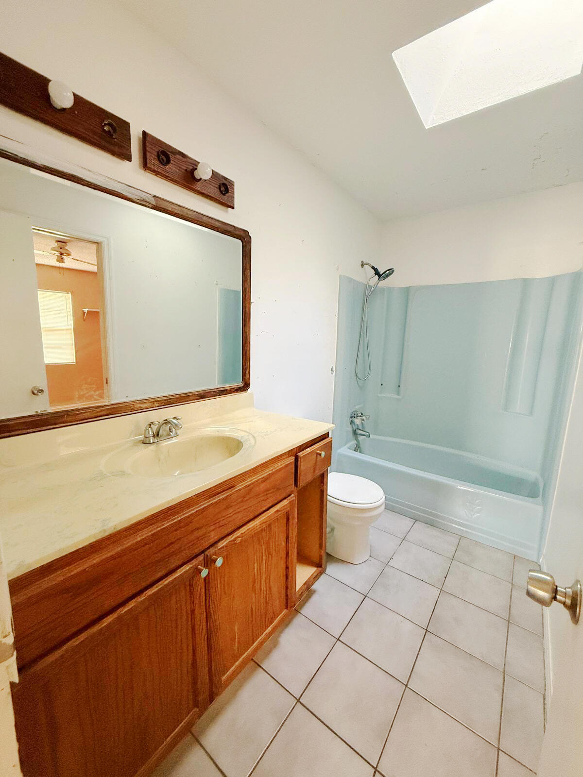 2361 Southeast 27th Street Okeechobee, FL 34974 - Photo 25 of 31 a bathroom with a sink a toilet and shower