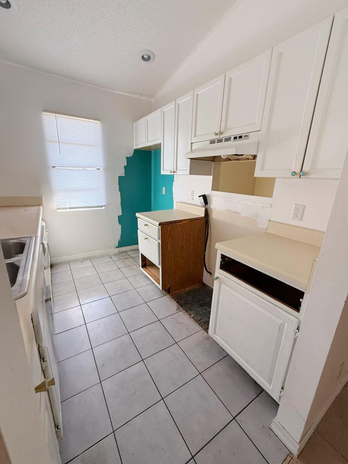 2361 Southeast 27th Street Okeechobee, FL 34974 - Photo 4 of 31 a kitchen with a cabinets and window