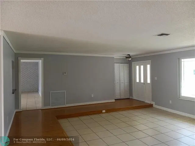 a view of an empty room and window