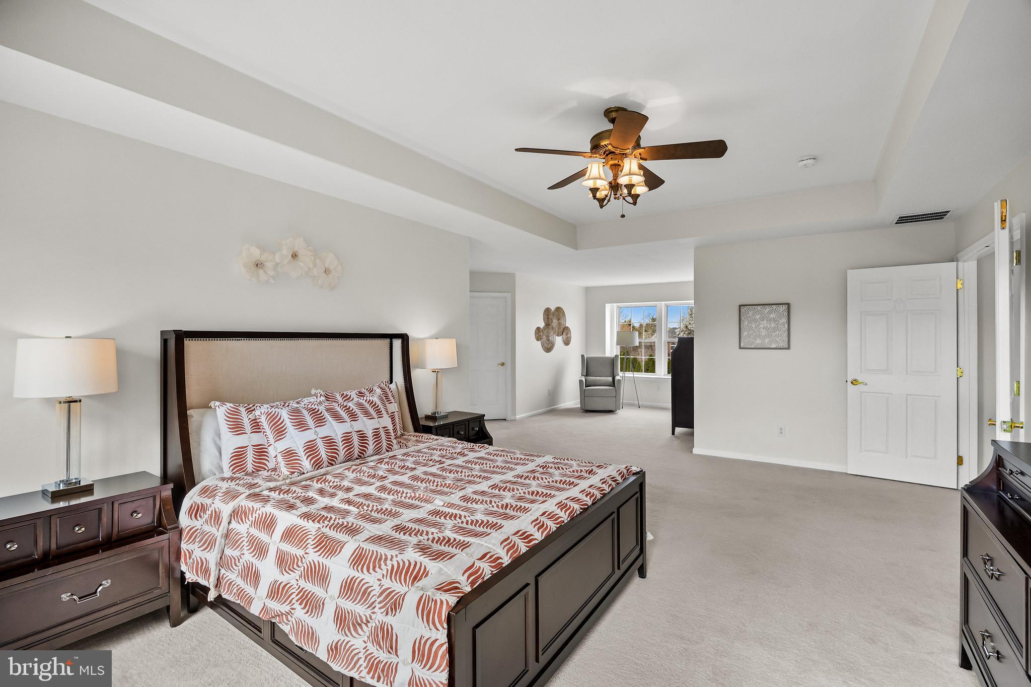 5 Periwinkle Place Lumberton, NJ 08048 - Photo 34 of 61 a bedroom with a large bed and a chandelier fan