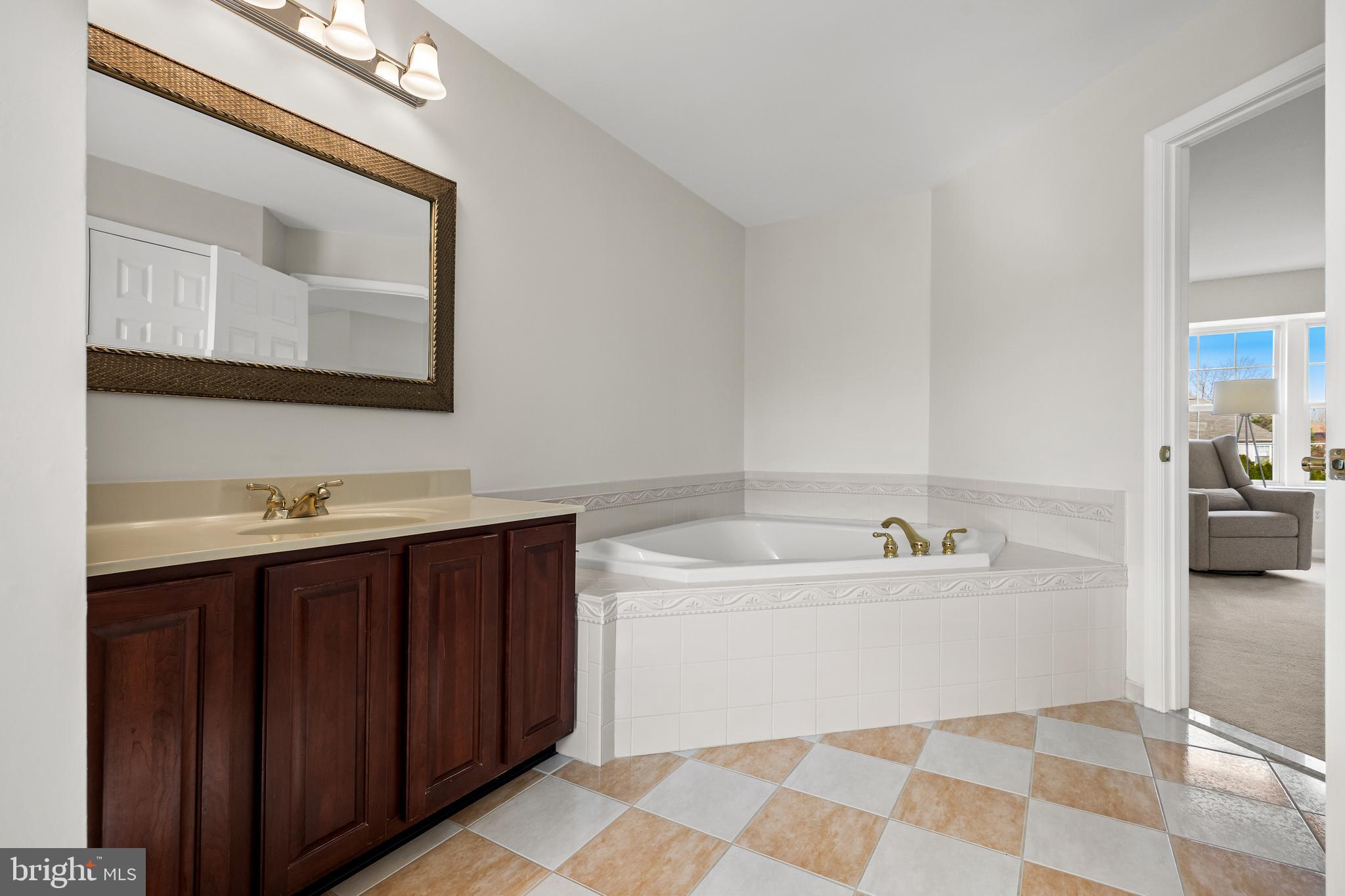 5 Periwinkle Place Lumberton, NJ 08048 - Photo 37 of 61 a spacious bathroom with a bathtub sink and mirror