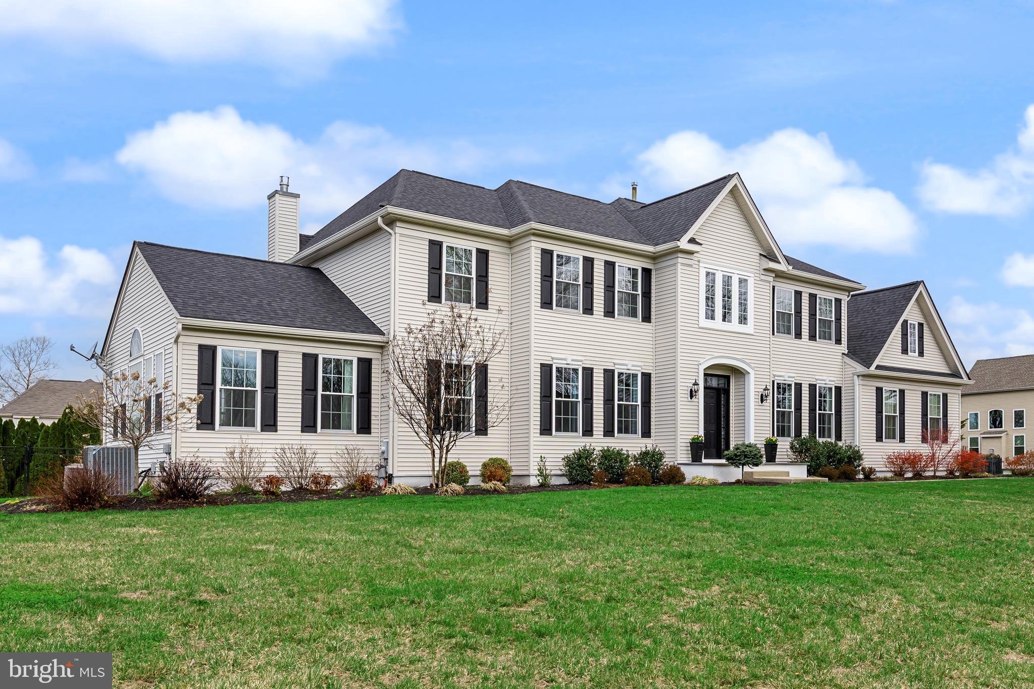 5 Periwinkle Place Lumberton, NJ 08048 - Photo 60 of 61 a front view of a house with a garden and plants