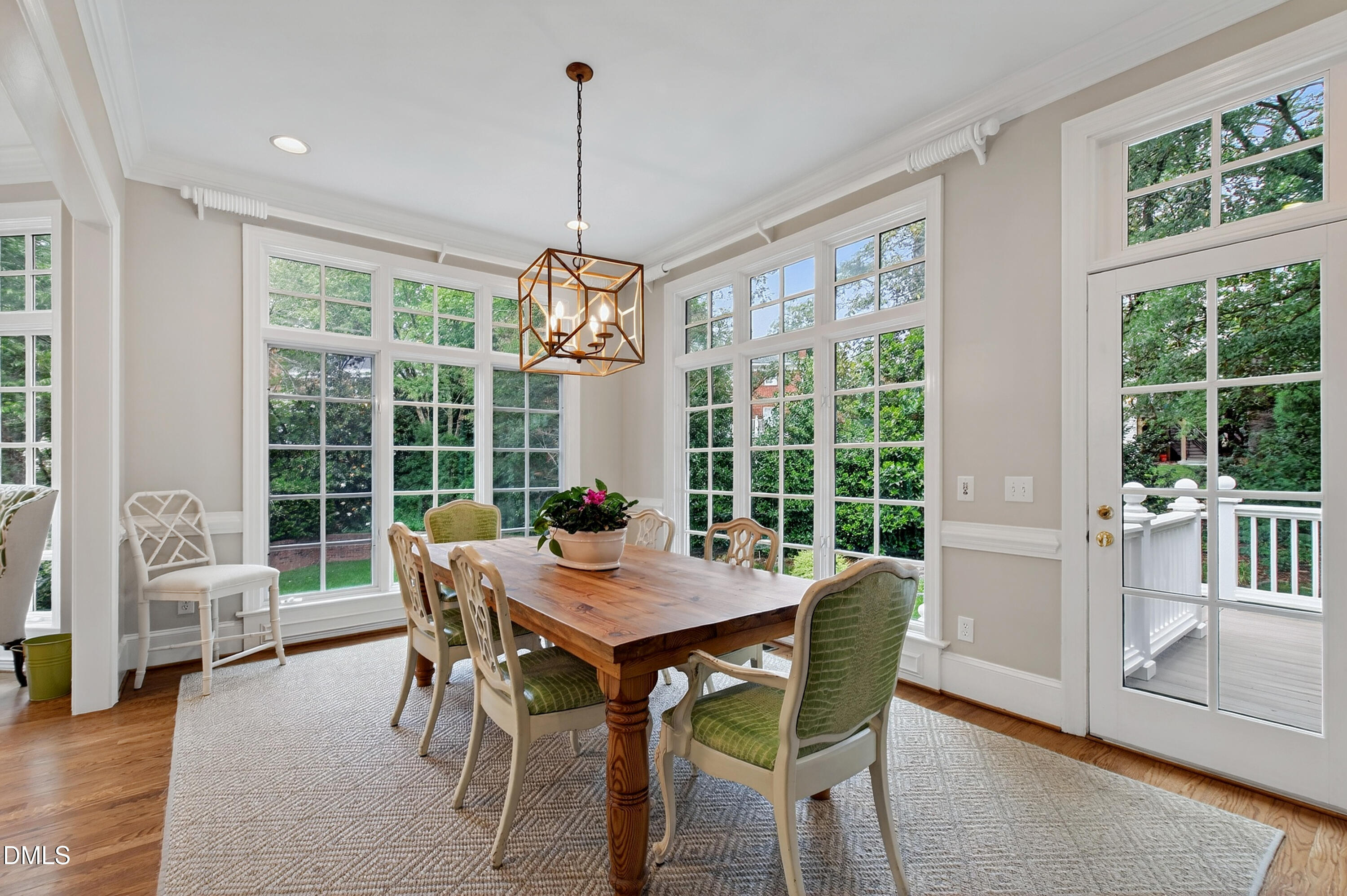 2536 Wake Drive Raleigh, NC 27608 - Photo 20 of 74 a view of a dining room with furniture large windows and wooden floor