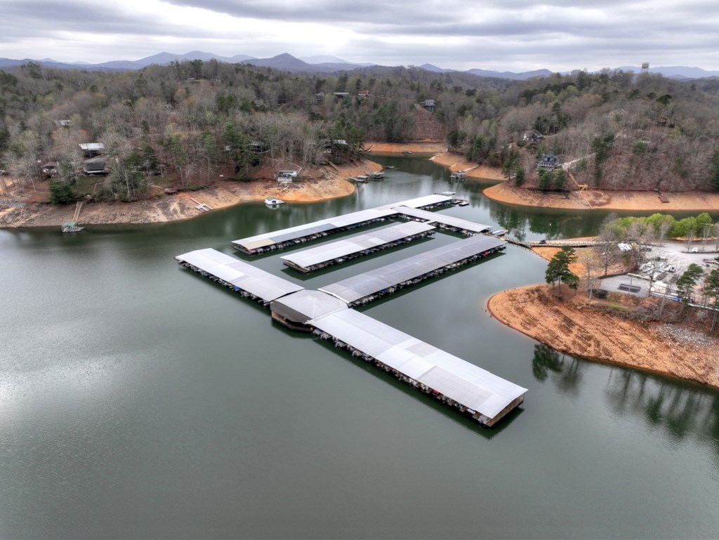 190 Village Road Murphy, NC 28906 - Photo 21 of 50 a view of a lake with a mountain