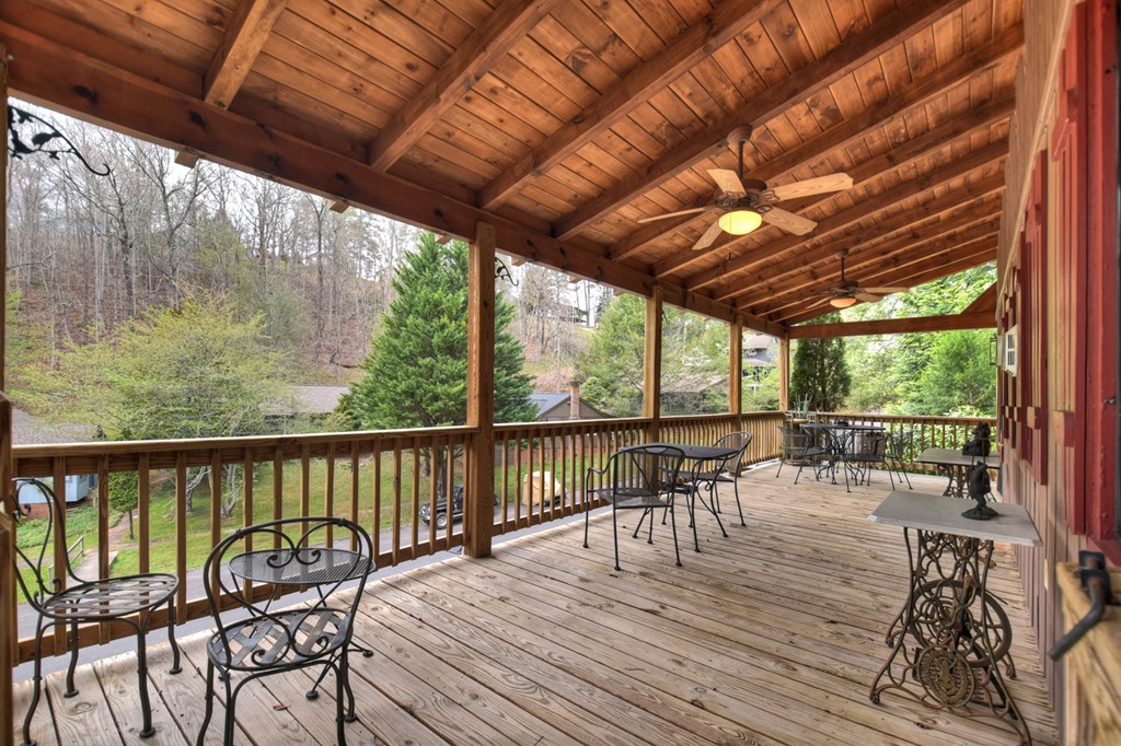 190 Village Road Murphy, NC 28906 - Photo 28 of 50 a view of a balcony with chairs and wooden floor