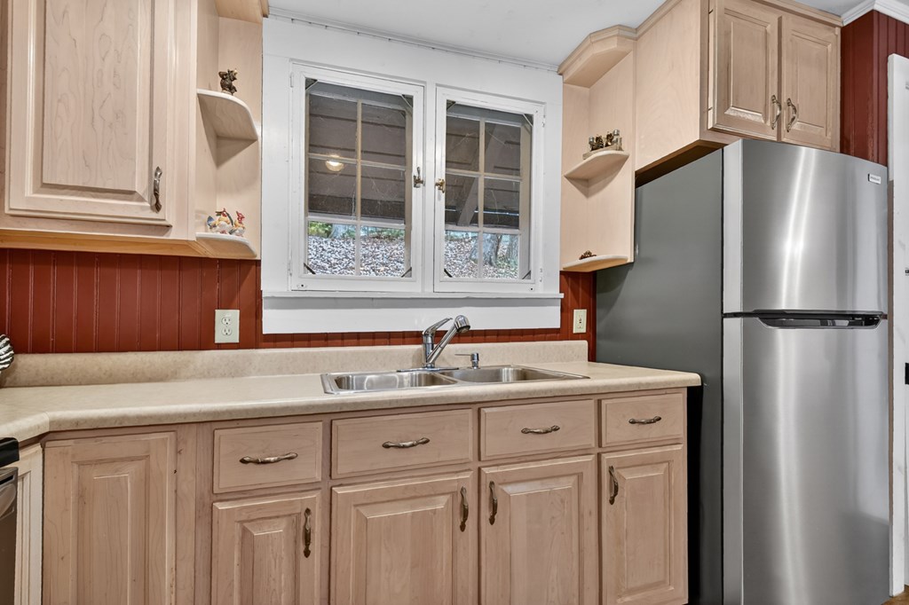 190 Village Road Murphy, NC 28906 - Photo 38 of 50 a kitchen with a sink and a refrigerator