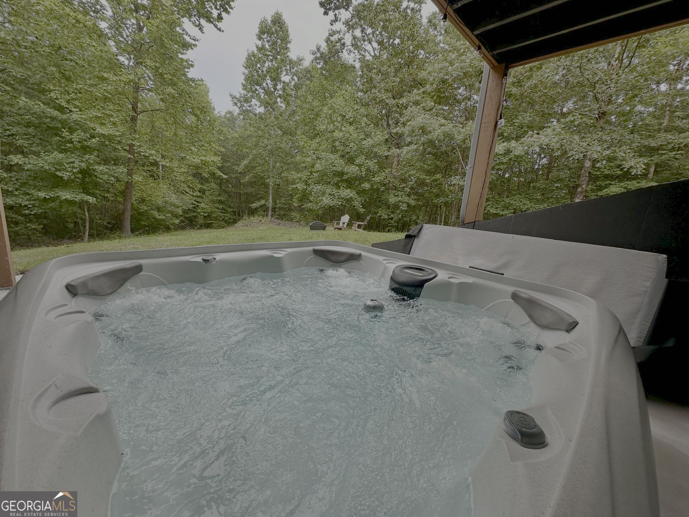 2769 Bean Creek Road Sautee Nacoochee, GA 30571 - Photo 32 of 33 a view of a swimming pool and trees in the background