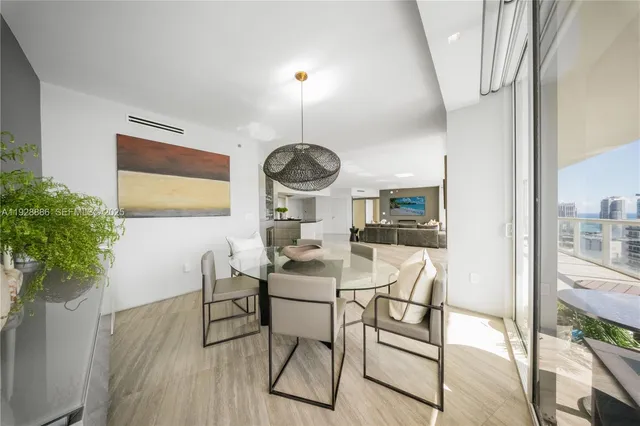 a large white kitchen with a large window