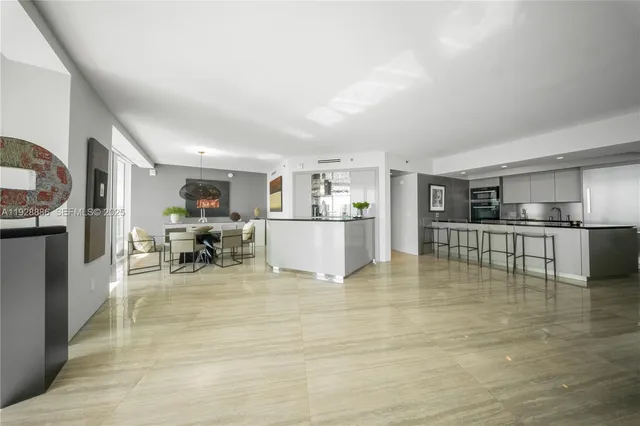 a spacious bedroom with a bed and a large window