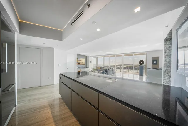 a spacious bathroom with a toilet sink and shower