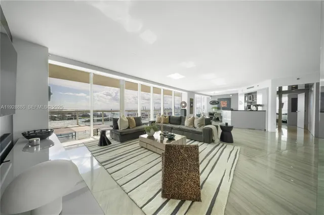 a view of a living room with a large window