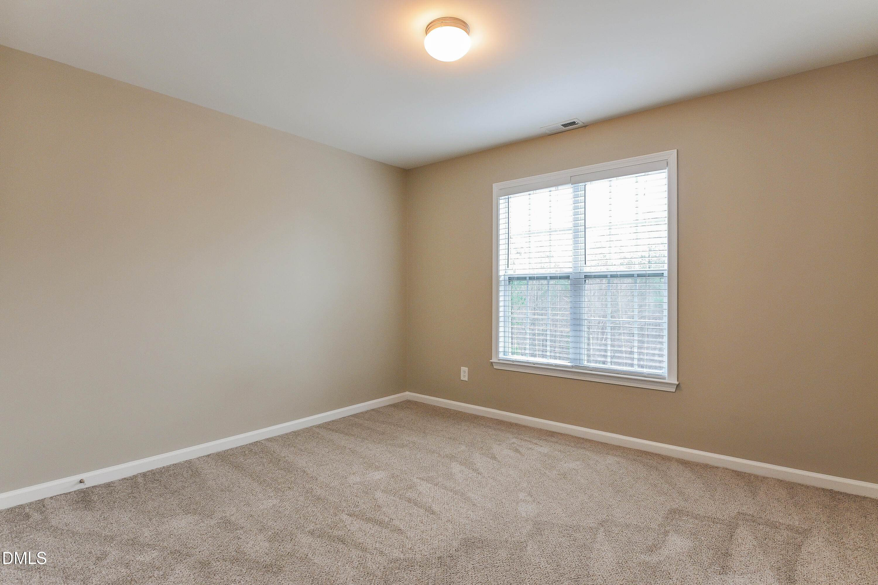 88 Meadow Loop Drive Clayton, NC 27527 - Photo 12 of 15 an empty room with a window